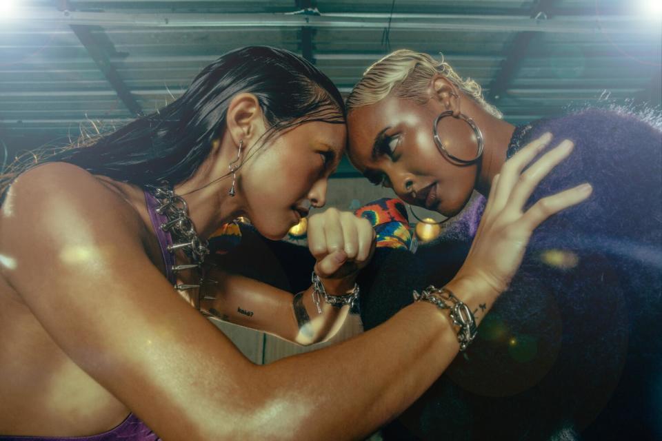 Two boxers face off in a ring.