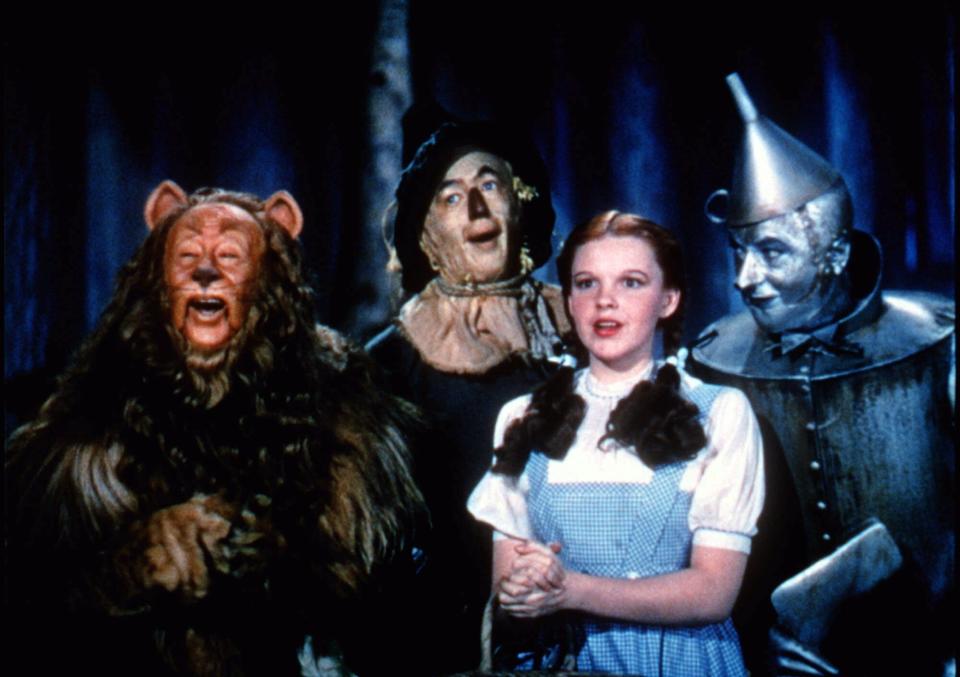 The Cowardly Lion (Bert Lahr), The Scarecrow (Ray Bolger), Dorothy (Judy Garland) and the Tin Man (Jack Haley) are off to see the Wizard in "The Wizard of Oz."