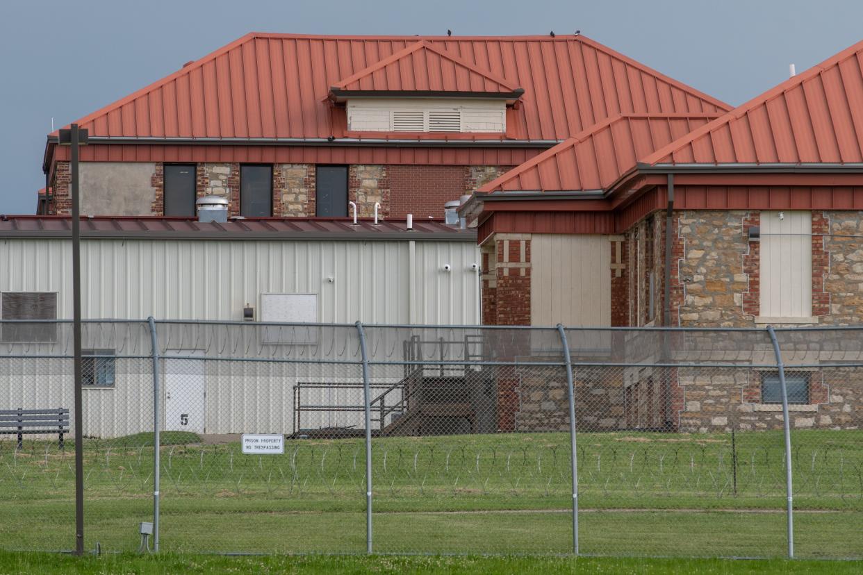 Buildings from the Kansas Vocational School, a campus originally built as a Tuskegee-affiliated vocational school for African-American residents, now feature huge barbed wire fences and "No Trespassing" signs as the area is part of the Topeka Correctional Facility.