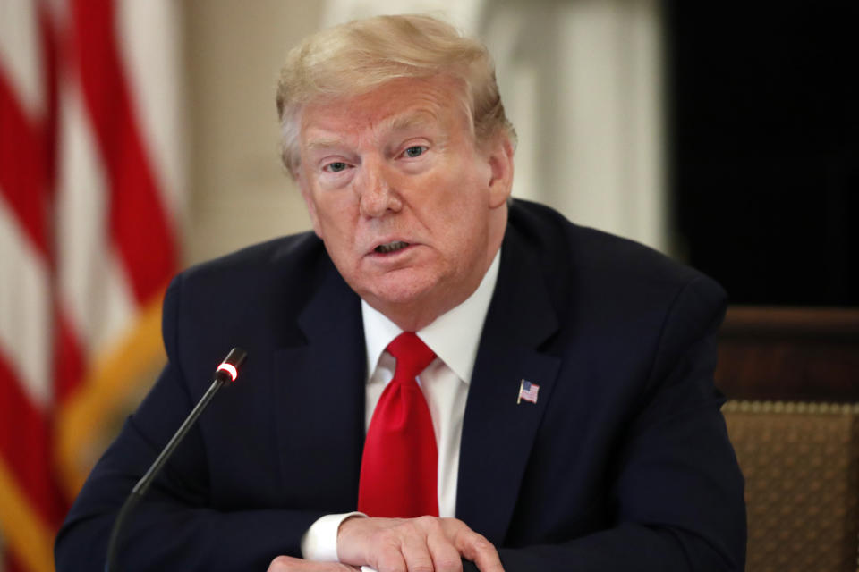 President Donald Trump speaks about reopening the country, during a roundtable with industry executives, in the State Dinning Room of the White House, Wednesday, April 29, 2020, in Washington. (AP Photo/Alex Brandon)