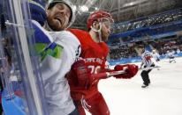 Ice Hockey – Pyeongchang 2018 Winter Olympics – Men Preliminary Round Match – Olympic Athletes from Russia v Slovenia - Gangneung Hockey Centre, Gangneung, South Korea – February 16, 2018 - Robert Sabolic of Slovenia and Mikhail Grigorenko, an Olympic Athlete from Russia, compete. REUTERS/Kim Kyung-Hoon