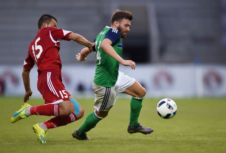 Football Soccer - Northern Ireland v Belarus - International Friendly - Windsor Park, Belfast, Northern Ireland - 27/5/16 Northern Ireland's Stuart Dallas in action with Belarus' Sergei Kislyak Reuters / Clodagh Kilcoyne