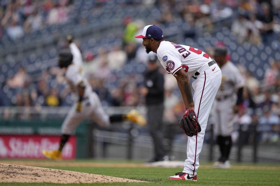 Washington Nationals relief pitcher Carl Edwards Jr. reacts as Pittsburgh Pirates' Miguel Andujar, back left, rounds the bases after hitting a two-run home run in the sixth inning of the first baseball game of a doubleheader, Saturday, April 29, 2023, in Washington. (AP Photo/Patrick Semansky)