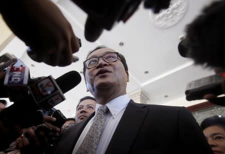 Sam Rainsy, President of the Cambodia National Rescue Party (CNRP), speaks to media after a meeting at the National Assembly in central Phnom Penh August 8, 2014. REUTERS/Samrang Pring