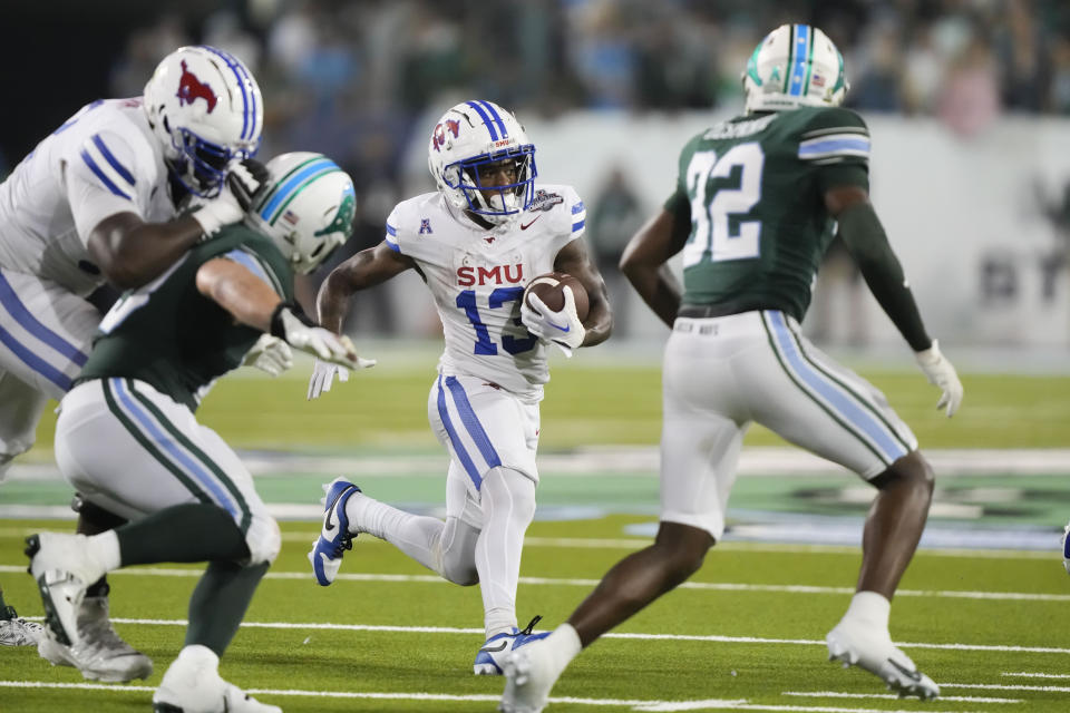 SMU wide receiver Roderick Daniels Jr. (13) carries during the second half of the American Athletic Conference championship NCAA college football game against Tulane, Saturday, Dec. 2, 2023 in New Orleans. SMU won 26-14. (AP Photo/Gerald Herbert)