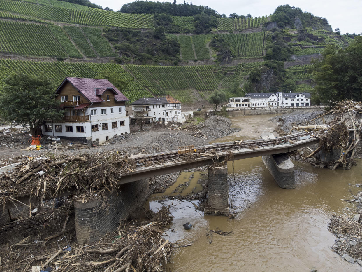 DERNAU, GERMANY - AUGUST 04: Destroyed houses, hotels and railway tracks pictured during ongoing cleanup efforts in the Ahr Valley region following catastrophic flash floods on August 04, 2021 near Dernau, Germany. Villages along the Ahr river as well as other towns and villages across western Germany are attempting to recover from devastating floods in mid-June that left at least 170 people dead, hundreds injured and approximately 70 still missing.  (Photo by Thomas Lohnes/Getty Images)