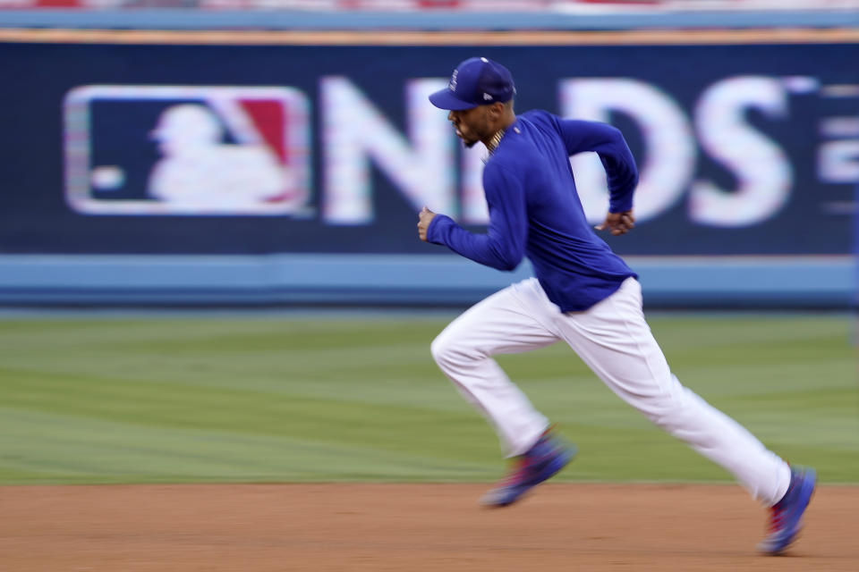 Los Angeles Dodgers' Mookie Betts runs the bases during baseball practice Monday, Oct. 10, 2022, in Los Angeles for the National League division series against the San Diego Padres. (AP Photo/Mark J. Terrill)