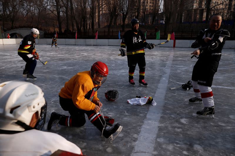 The Wider Image: On a frozen pond far from the Olympics, meet China's ice hockey veterans