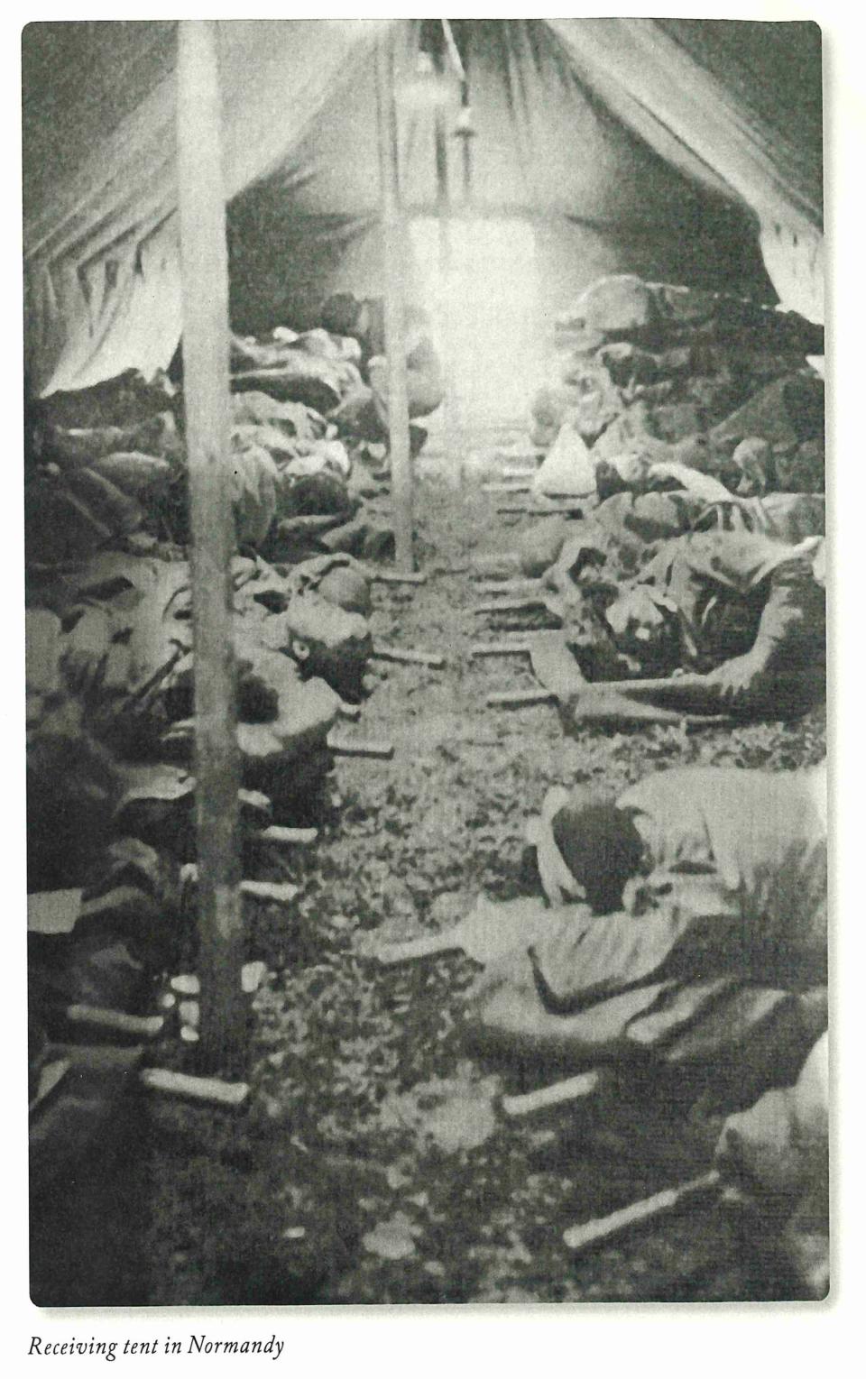 Seriously wounded GIs await treatment in the receiving tent near Utah  Beach.
