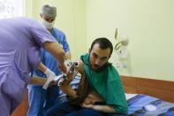 A man, according to Ukraine's state security service (SBU) is named Yevgeny Yerofeyev and is one of two Russian servicemen recently detained by Ukrainian forces, is examined by medics at a hospital in Kiev, Ukraine, May 28, 2015. Picture taken May 28, 2015. REUTERS/Valentyn Ogirenko