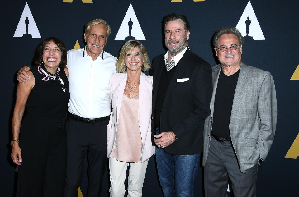 Pink Ladies favorite Didi Conn, left, and T-Bird Barry Pearl, far right, joined the stars and director Randal Kleiser. (Photo: Steve Granitz/WireImage)