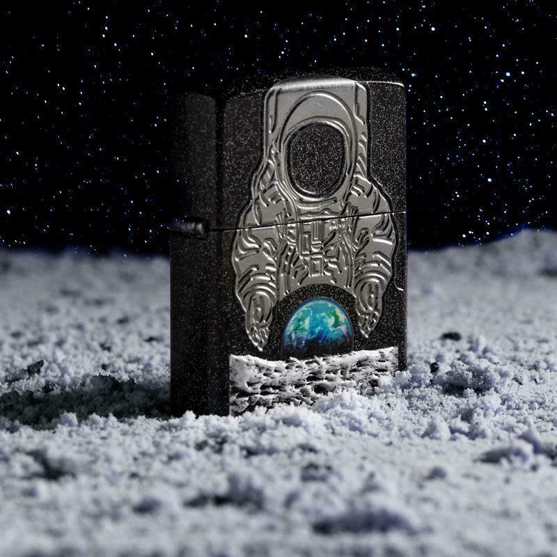 This photo provided by Zippo in June 2019 shows a limited edition lighter released in tribute to the 50th anniversary of the Apollo 11 moon landing. The company has sold out of the 14,000 limited edition lighters. (Zippo via AP)