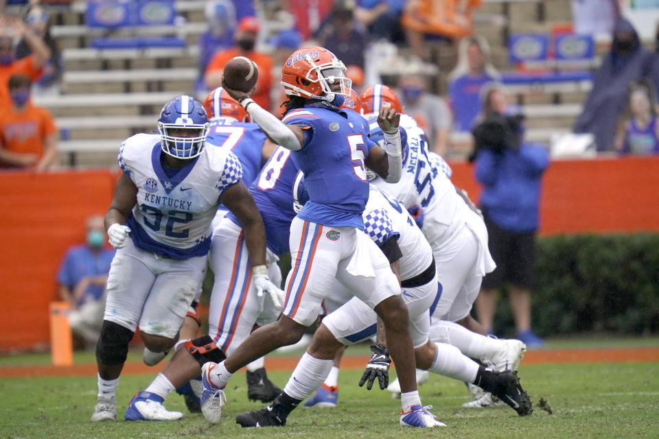 Florida quarterback Emory Jones (5) throws a pass during the second half of an NCAA college football game against Kentucky, Saturday, Nov. 28, 2020, in Gainesville, Fla. (AP Photo/John Raoux)