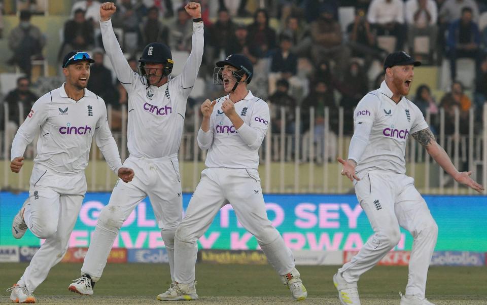England's players celebrates after last wicket out of Pakistan's Naseem Shah (not pictured) during the fifth and final day of the first cricket Test match between Pakistan and England at the Rawalpindi Cricket Stadium - AFP