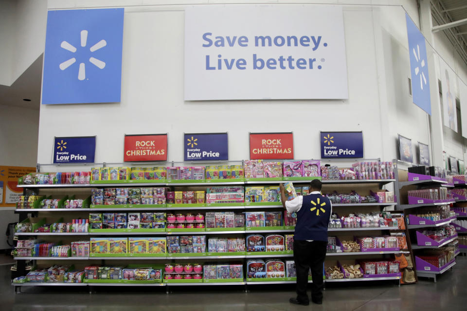 FILE- In this Nov. 9, 2017, file photo, a Walmart employee scans items while conducting an exercise during a Walmart Academy class session at the store in North Bergen, N.J. Walmart reports earnings on Thursday, Aug. 16, 2018. (AP Photo/Julio Cortez, File)