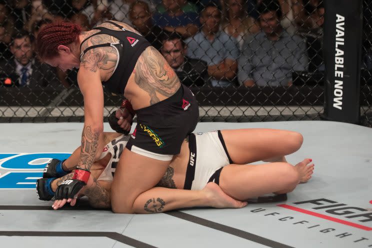 Cris Justino (top), shown during a Sept. 24 win over Lina Lansberg, won't be part of it when the UFC debuts a women's featherweight division on Feb. 11 at the Barclays Center in Brooklyn.