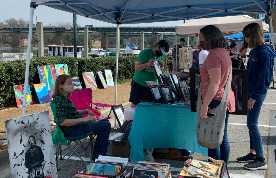 FILE - Residents can shop for various hand-crafted items at the 5th Street Marina's Holiday Market at the Marina on Sunday near the Riverwalk in Augusta.