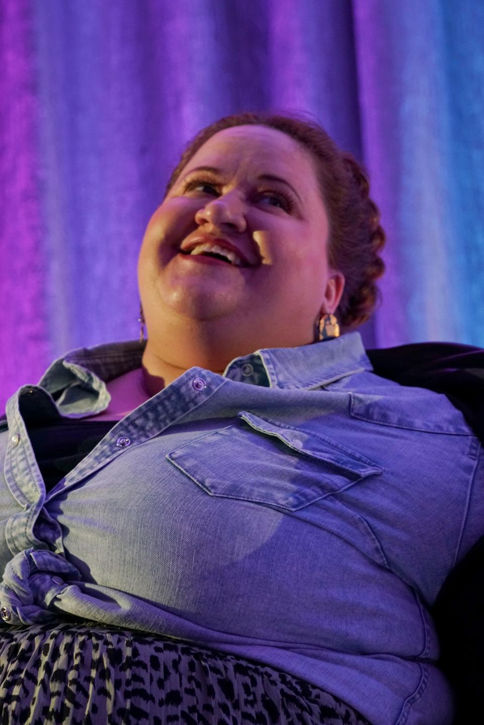 Abby Bischoff smiles while modeling during the Style Show in downtown Sioux Falls on Saturday, May 7, 2022.