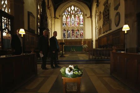 Flowers are laid on the planned site for the tomb of King Richard III in Leicester Cathedral, central England, in this file photograph dated September 19, 2013. King Richard III, the medieval English monarch whose remains were found under a car park three years ago, will be reburied on March 26, 2015 nearly 530 years after he was slain in battle and dumped in an humble grave. REUTERS/Darren Staples/files