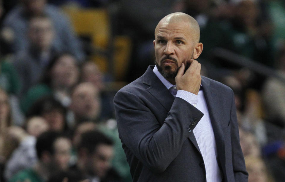 Brooklyn Nets coach Jason Kidd scratches his beard during the first quarter of an NBA basketball game against the Boston Celtics, Friday, March 7, 2014, in Boston. (AP Photo/Charles Krupa)