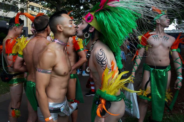 Parade goers kiss during the 2020 Sydney Gay & Lesbian Mardi Gras Parade on February 29, 2020 in Sydney, Australia. 