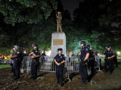 <p>Police wearing riot gear guard a statue of a Confederate soldier nicknamed Silent Sam on the campus of the University of North Carolina during a demonstration for its removal in Chapel Hill, N.C., Aug. 22, 2017. (Photo: Jonathan Drake/Reuters) </p>