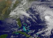 This NASA/NOAA Goes East satellite image shows Hurricane Joaquin (R) near Bermuda on October 4, 2015