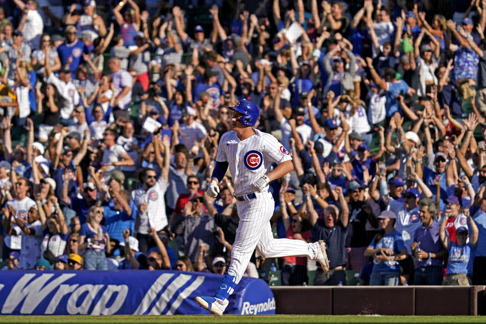 Chicago Cubs' Frank Schwindel rounds the bases after hitting a grand slam during the seventh inning of a baseball game against the Pittsburgh Pirates in Chicago, Sunday, Sept. 5, 2021. (AP Photo/Nam Y. Huh)