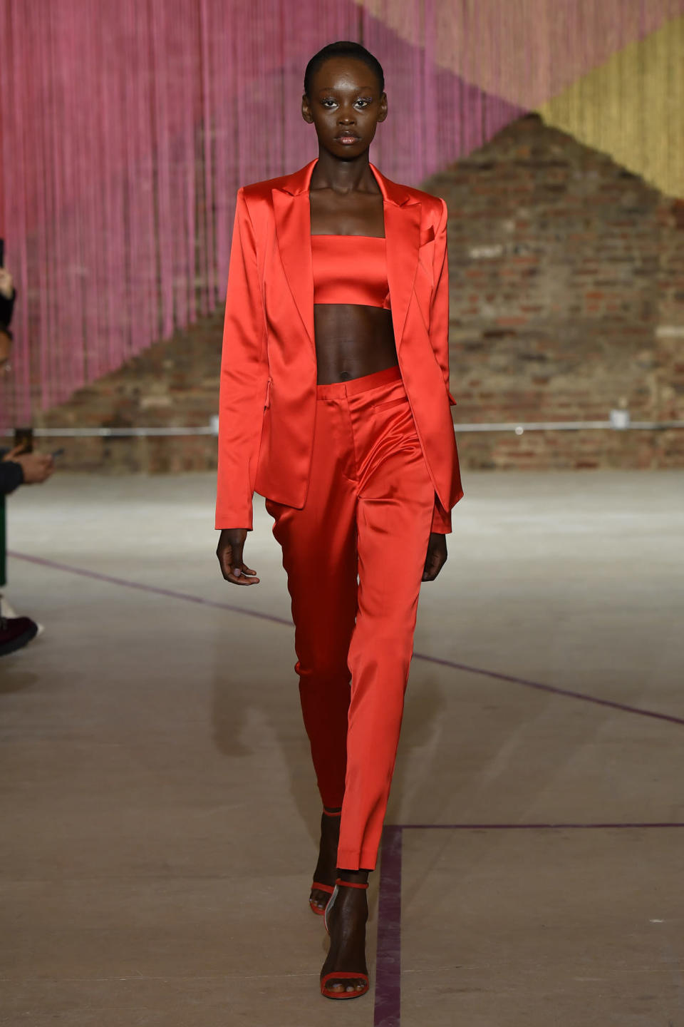 <p>Model wears a red pantsuit at the fall 2018 Milly show. (Photo: Getty Images) </p>