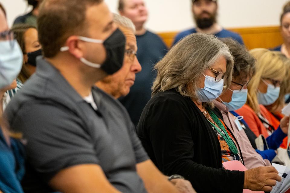 Dr. Annette Mercatante, right, listens to public comment during a board of commissioners meeting Thursday, Oct. 7, 2021, in Port Huron. Last month, Mercatante, St Clair County's medical health officer, was asked to rescind a public health order. She didn't, but it was subsequently two weeks later.