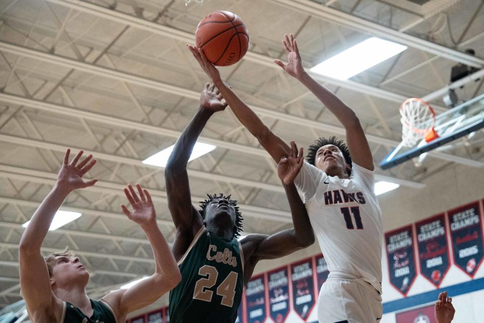 Hartley's Ethan Godfrey (11) grabs a rebound against Dublin Jerome on Dec. 20.