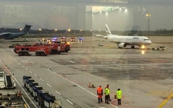 Emergency services on the tarmac at Hannover airport, after a car drove onto the runway