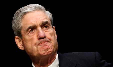 FILE PHOTO: FILE PHOTO: Robert Mueller, as FBI director, testifies before a Senate Intelligence Committee hearing on Capitol Hill in Washington March 12, 2013. REUTERS/Kevin Lamarque/File Photo/File Photo