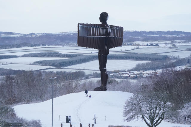 People sledging in the snow at the foot of Antony Gormley&#39;s Angel of the North sculpture in Gateshead, Tyne and Wear. Picture date: Friday March 10, 2023.