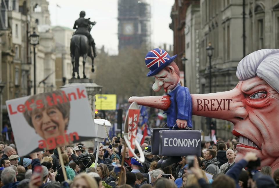 An effigy of British Prime Minister Theresa May is wheeled through Trafalgar Square during a Peoples Vote anti-Brexit march in London, Saturday, March 23, 2019. The march, organized by the People's Vote campaign is calling for a final vote on any proposed Brexit deal. This week the EU has granted Britain's Prime Minister Theresa May a delay to the Brexit process. (AP Photo/Tim Ireland)