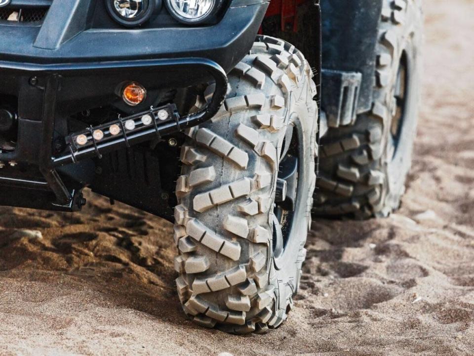 An ATV tire is pictured in an undated photo. RCMP say a teenager was killed in an ATV rollover near Williams Lake, B.C., on Sunday. (frantic00/Shutterstock - image credit)