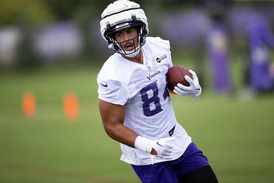 Josh Oliver carries the ball at a July 29, 2023, training camp practice in Eagan, Minnesota. Oliver is a graduate of Paso Robles High School.