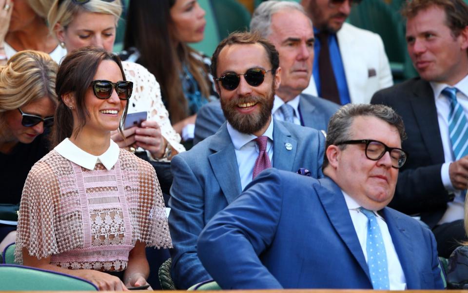 Pippa and James Middleton sit behind Tom Watson - Credit: Clive Brunskill/Getty Images