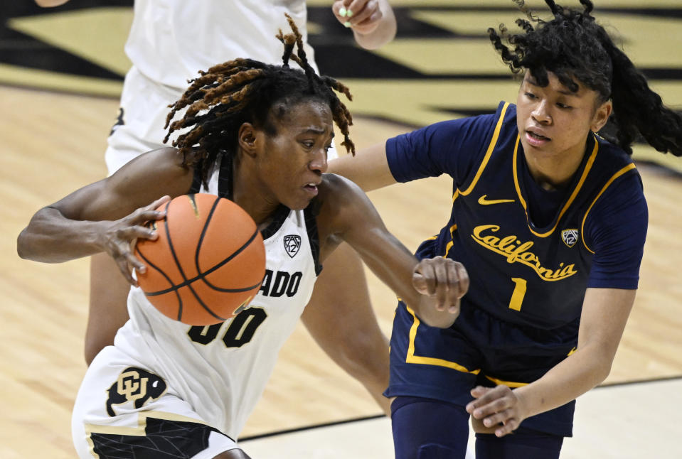 Colorado guard Jaylyn Sherrod, left, drives against California guard Leilani McIntosh during the second half of an NCAA college basketball game Friday, Jan, 12, 2024, in Boulder, Colo. (AP Photo/Cliff Grassmick)