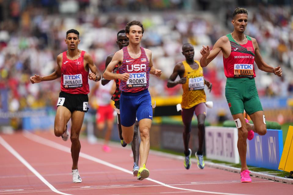 Soufiane El Bakkali, of Morocco, right, Kenneth Rooks, of the United States and Mohamed Amin Jhinaoui, of Tunisia cross the line to finish a heat of the Men’s 3000-meters steeplechase during the World Athletics Championships in Budapest, Hungary, Saturday, Aug. 19, 2023. | Petr David Josek, Associated Press