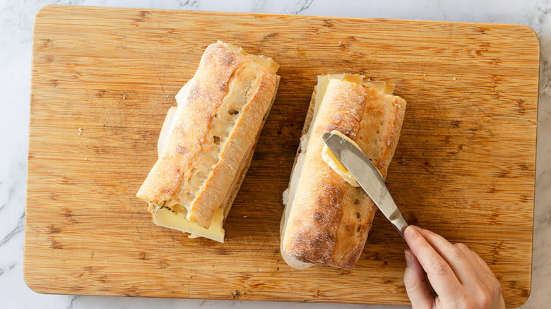 Smearing bread with butter