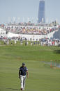 <p>Tiger Woods walks down the first fairway during the first round of the Presidents Cup at Liberty National Golf Club in Jersey City, N.J., Sept. 28, 2017. (Photo: Julio Cortez/AP) </p>