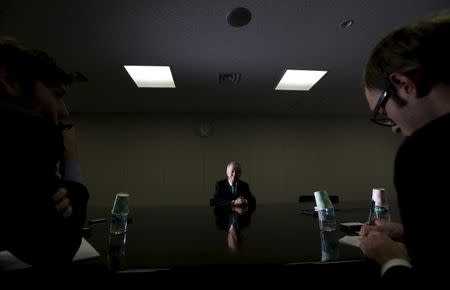 Tokyo Electric Power Co's (TEPCO) President Naomi Hirose speaks (C) during a group interview at the company's headquarters in Tokyo, Japan February 5, 2016. REUTERS/Toru Hanai