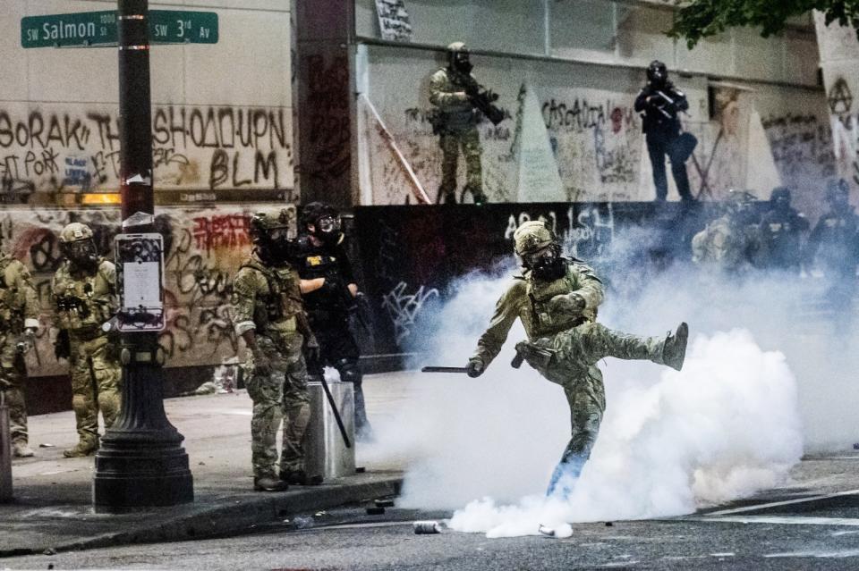 Federal officers on the streets of Portland on Tuesday.