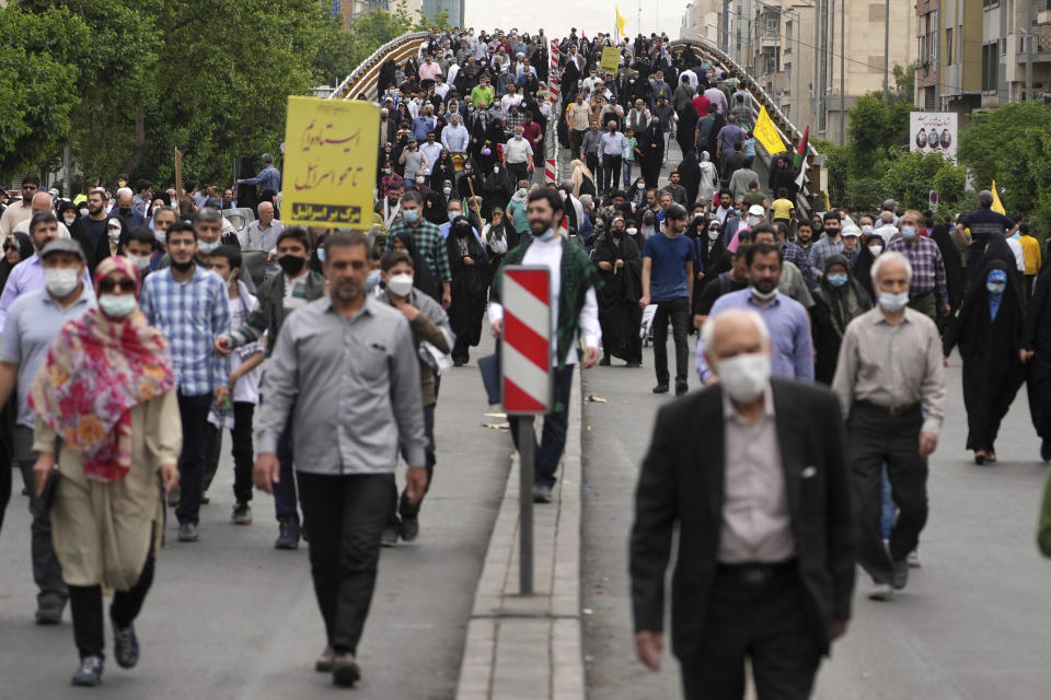 People attend the annual pro-Palestinian Al-Quds, or Jerusalem, Day rally in Tehran, Iran, Friday, April 29, 2022. Iran does not recognize Israel and supports Hamas and Hezbollah, militant groups that oppose it. (AP Photo/Vahid Salemi)