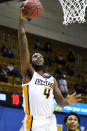 UNC-Greensboro forward Mohammed Abdulsalam (4) leaps to the basket against Mercer in the first half of an NCAA men's college basketball championship game for the Southern Conference tournament, Monday, March 8, 2021, in Asheville, N.C. (AP Photo/Kathy Kmonicek)