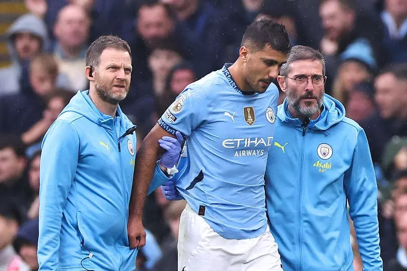 Manchester City midfielder Rodri limps off during the Premier League match against Arsenal.