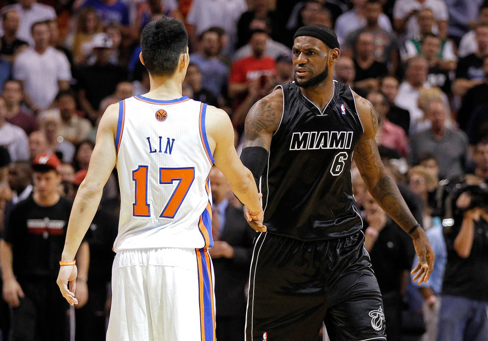 MIAMI, FL - FEBRUARY 23: Jeremy Lin #17 of the New York Knicks greets LeBron James #6 of the Miami Heat during a game at American Airlines Arena on February 23, 2012 in Miami, Florida. NOTE TO USER: User expressly acknowledges and agrees that, by downloading and/or using this Photograph, User is consenting to the terms and conditions of the Getty Images License Agreement. (Photo by Mike Ehrmann/Getty Images)