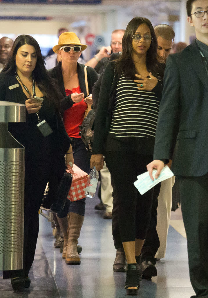 Zoe Saldana walking in a crowd