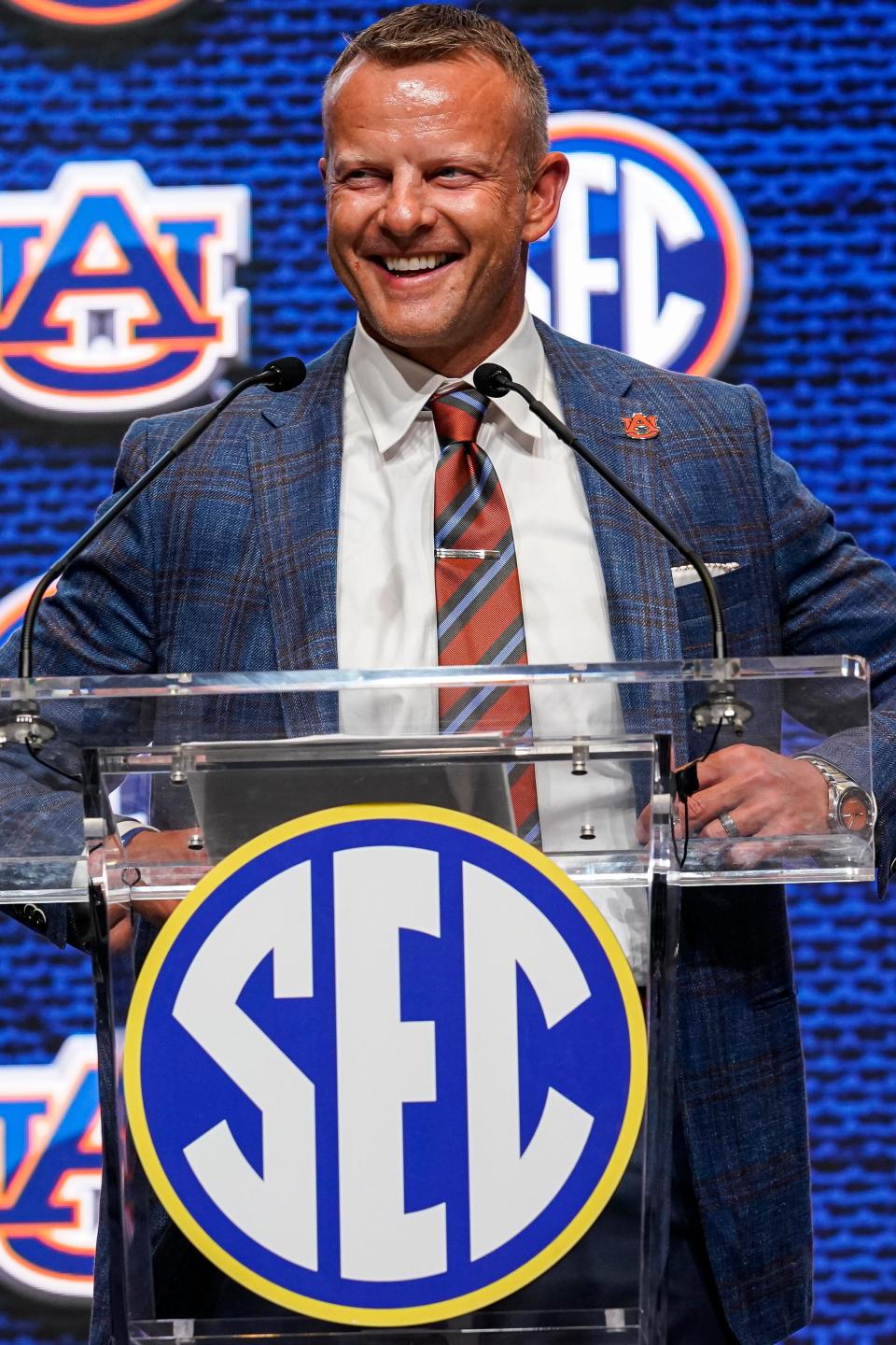 Jul 21, 2022; Atlanta, GA, USA; Auburn Tigers head coach Bryan Harsin shown on the stage during SEC Media Days at the College Football Hall of Fame. Mandatory Credit: Dale Zanine-USA TODAY Sports